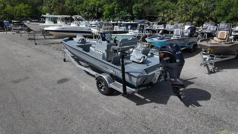 Slide: The Image of 2025 Xpress H20B boat on trailer in marina parking lot. - 17