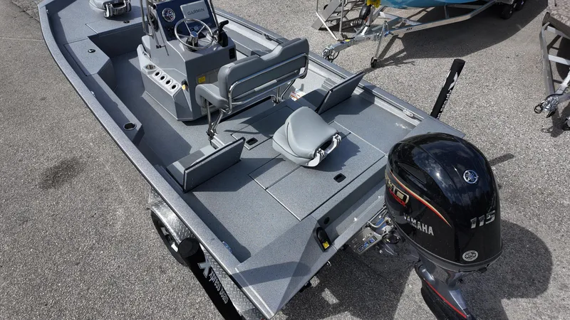 Slide: The Image of 2025 Xpress H20B boat with Yamaha outboard motor, featuring spacious deck and seating. - 18