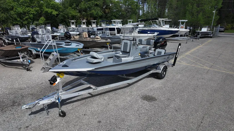 Slide: The Image of 2025 Xpress H20B boat on trailer in outdoor showroom. - 4
