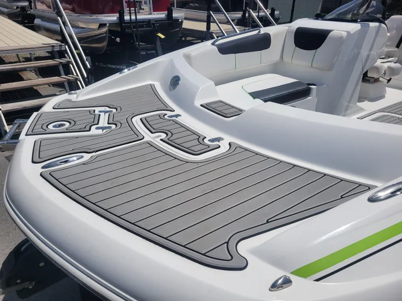 Slide: The Image of 2021 Tahoe 2150 boat with sleek deck design and comfortable seating. - 11