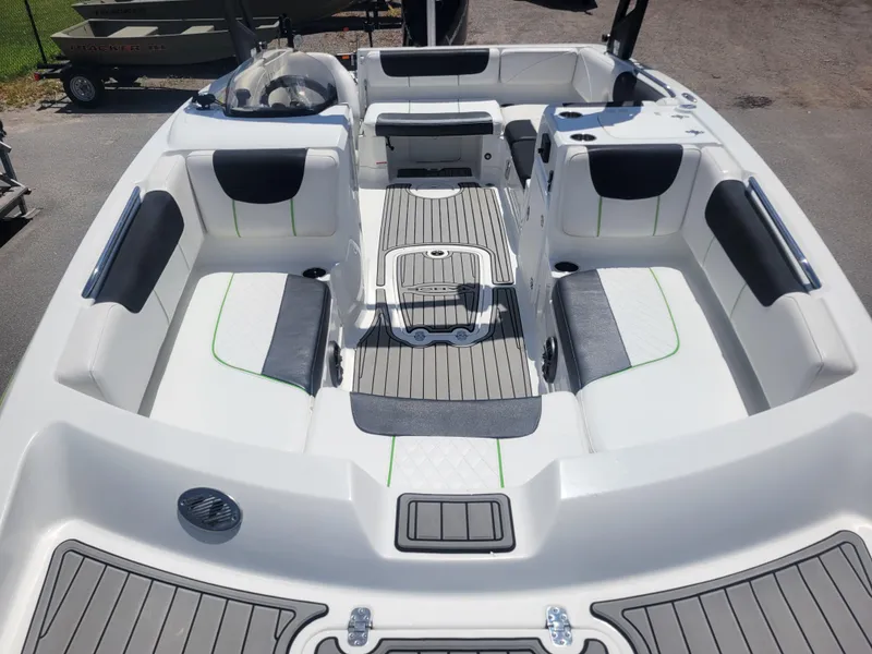 Slide: The Image of 2021 Tahoe 2150 boat interior with spacious seating and modern design. - 12