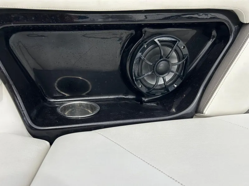 Slide: The Image of Speaker and cup holder on 2015 Yamaha Boats 242 Limited S interior. - 26
