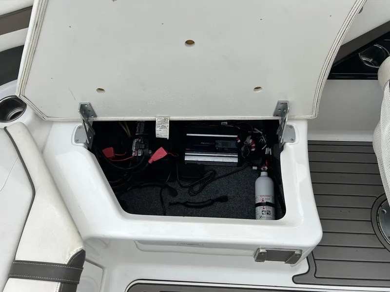 Slide: The Image of Open storage compartment in a 2015 Yamaha Boats 242 Limited S, showing interior components. - 30