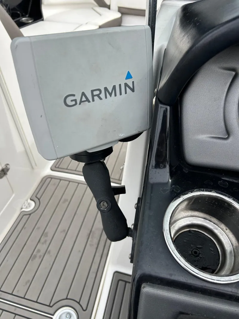 Slide: The Image of Garmin device mounted on 2015 Yamaha Boats 242 Limited S dashboard. - 5