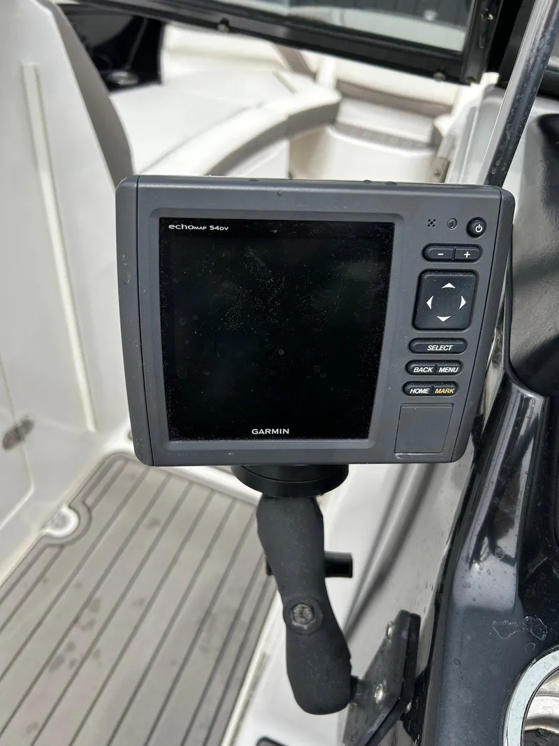 Slide: The Image of Garmin marine GPS device on 2015 Yamaha Boats 242 Limited S dashboard. - 6