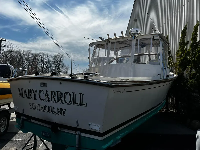 Slide: The Image of 1983 Fortier 26 boat named "Mary Carroll" docked in Southold, NY. - 1