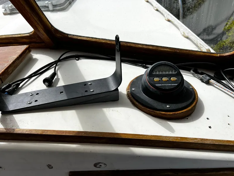Slide: The Image of Dashboard of a 1983 Fortier 26 boat with navigation equipment. - 19