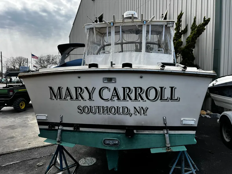 Slide: The Image of 1983 Fortier 26 boat named "Mary Carroll" in Southold, NY, docked outdoors. - 31