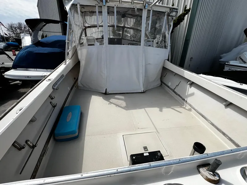 Slide: The Image of 1983 Fortier 26 boat deck with canopy and storage compartments. - 8