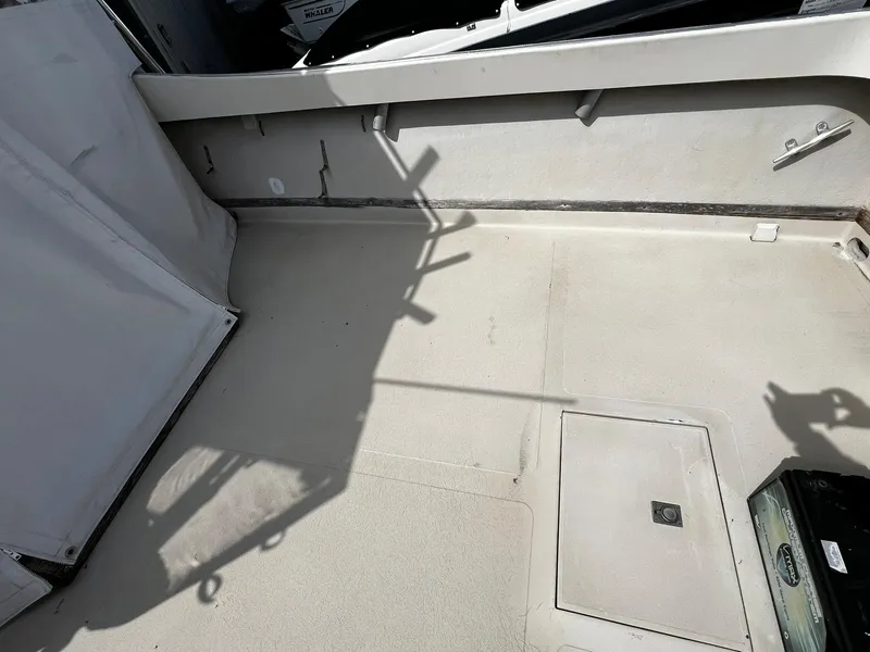 Slide: The Image of 1983 Fortier 26 boat deck with storage hatch and clean surface. - 9