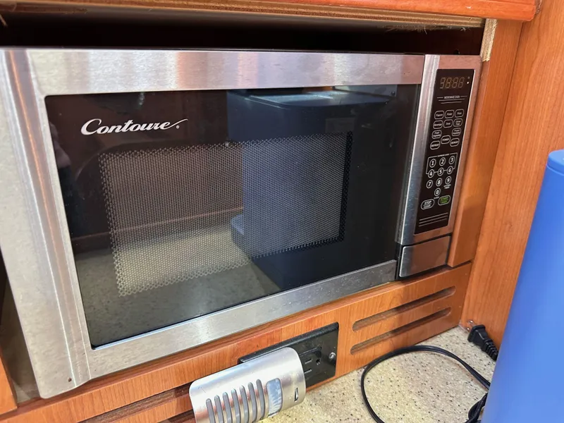 Slide: The Image of Microwave oven in a 2008 Hunter 38 yacht kitchen setup. - 48