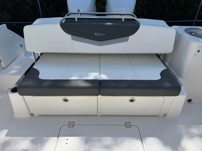 Slide: The Image of 2024 Robalo R317 boat seating area with storage compartments, featuring sleek design and comfortable cushions. - 12