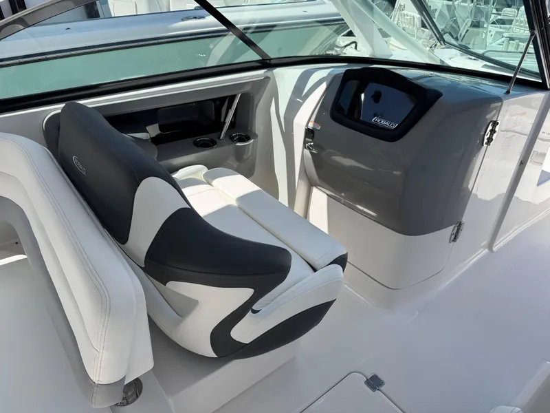 Slide: The Image of 2024 Robalo R317 boat interior with modern seating and dashboard design. - 16