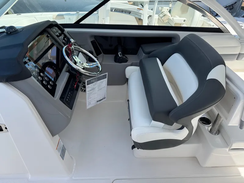 Slide: The Image of 2024 Robalo R317 helm with modern controls and comfortable seating. - 22