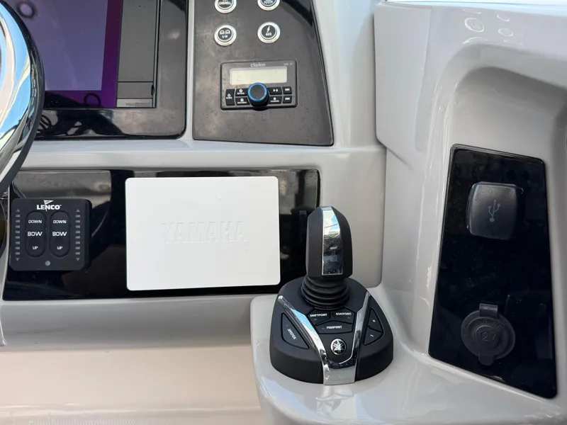 Slide: The Image of Control panel of 2024 Robalo R317 boat featuring joystick and electronic controls. - 26
