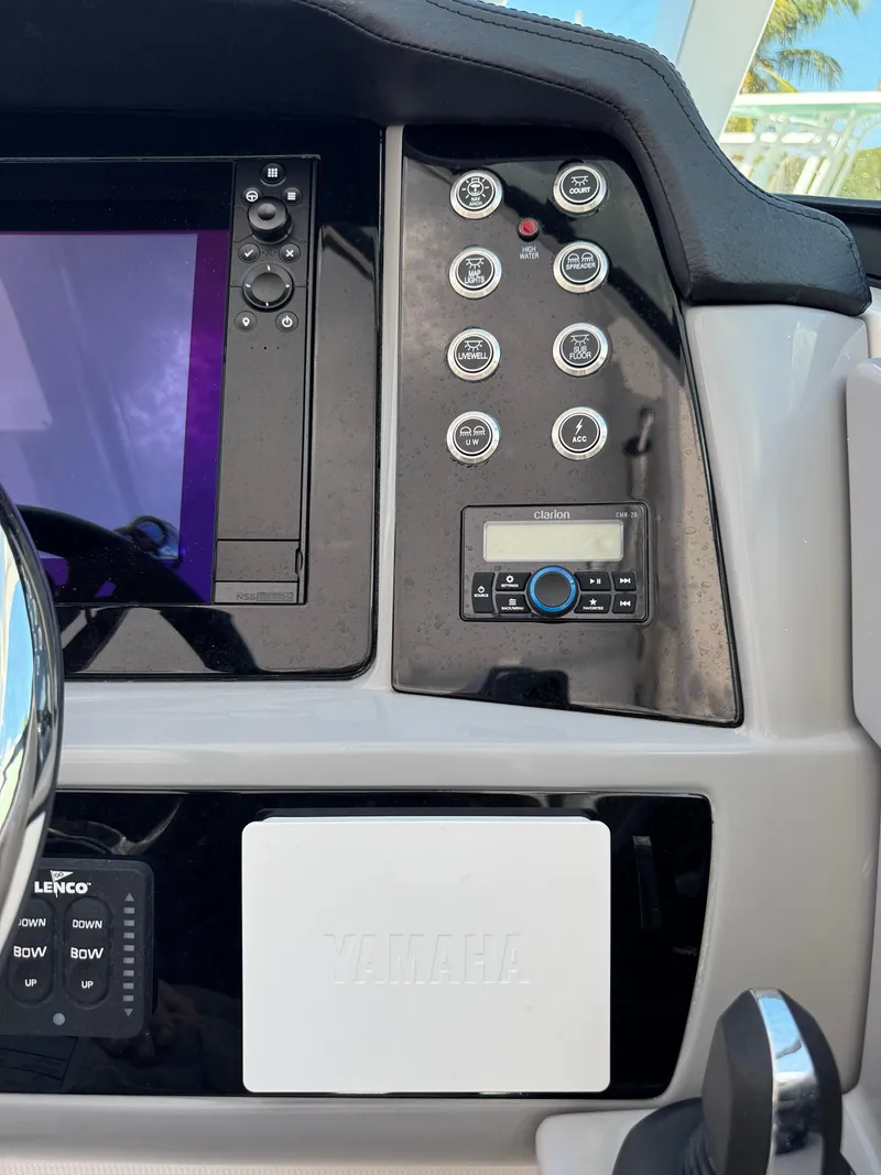 Slide: The Image of 2024 Robalo R317 dashboard with control panel and navigation system. - 27