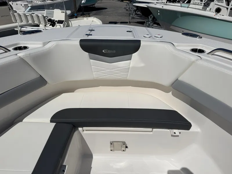 Slide: The Image of 2024 Robalo R317 boat interior with cushioned seating and modern design. - 34