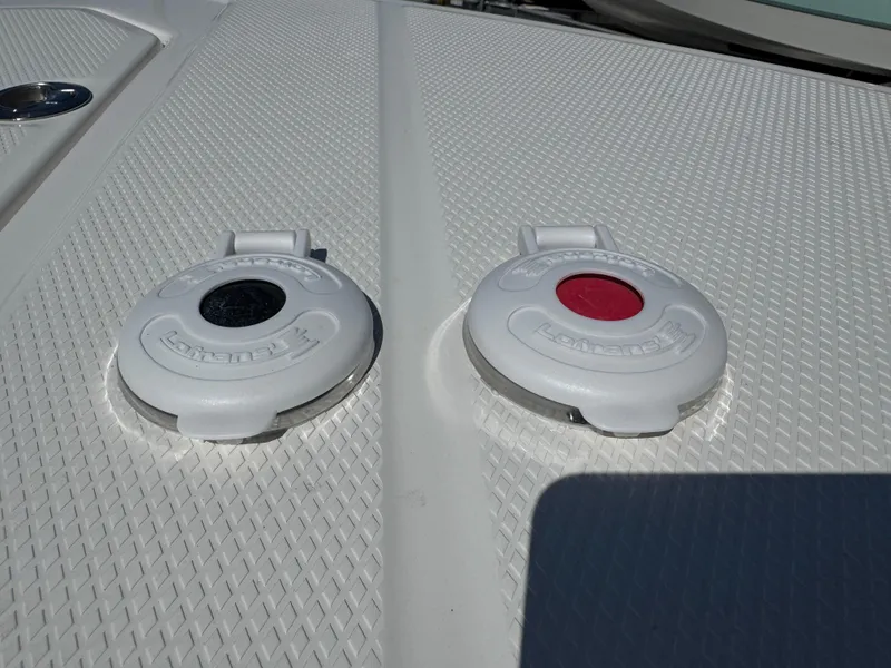 Slide: The Image of 2024 Robalo R317 boat deck with two white flush mount rod holders. - 35