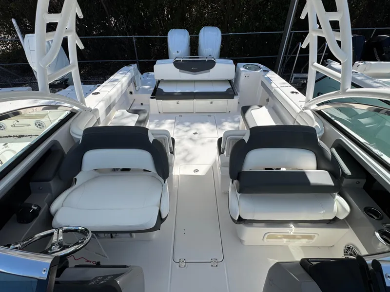 Slide: The Image of 2024 Robalo R317 boat interior with white seating and modern design. - 42
