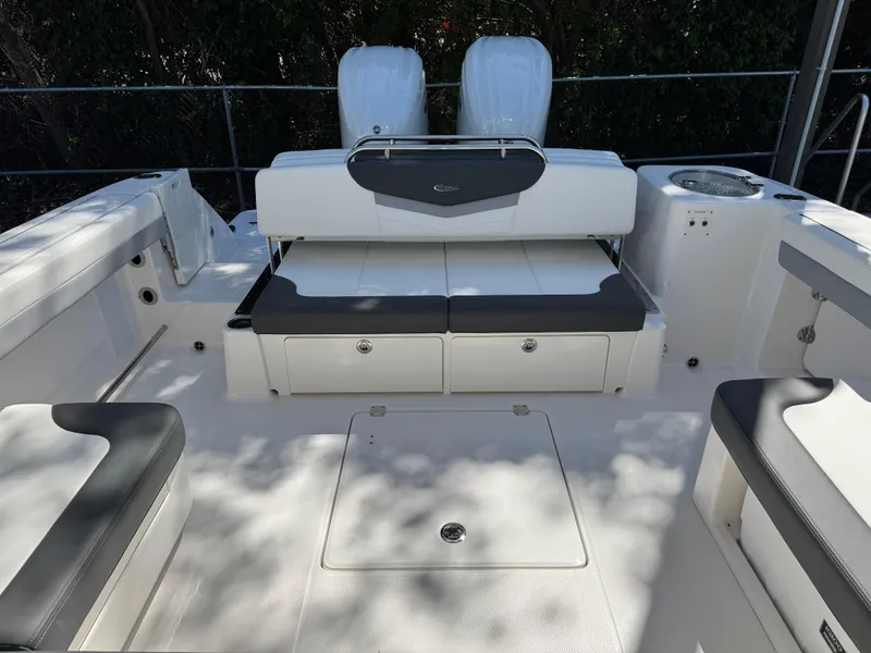 Slide: The Image of 2024 Robalo R317 boat interior with seating and storage compartments. - 45