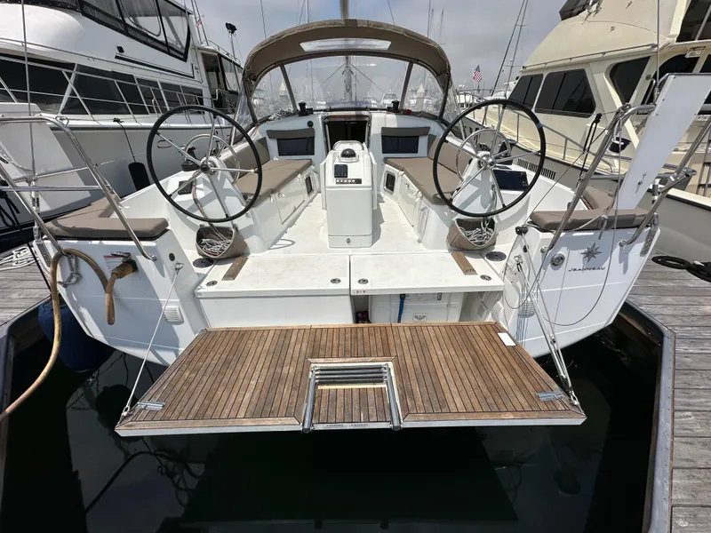 Slide: The Image of Jeanneau Sun Odyssey 410, 2020 model, docked with dual steering wheels and teak swim platform. - 18