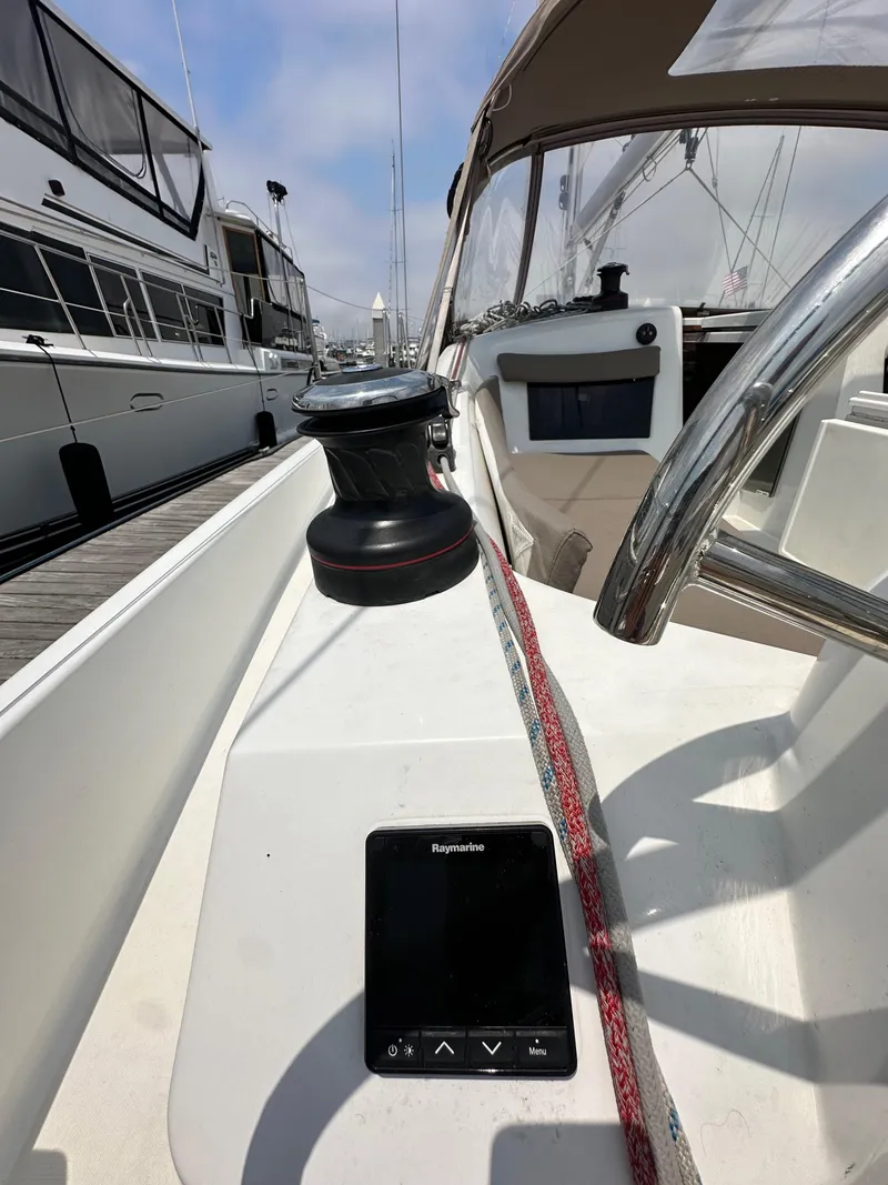 Slide: The Image of 2020 Jeanneau Sun Odyssey 410 sailboat cockpit with winch and navigation controls. - 45