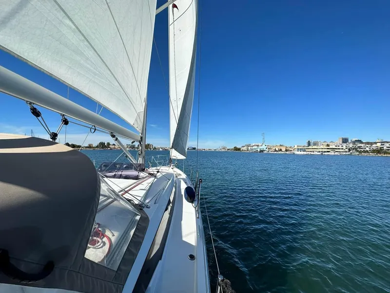 Slide: The Image of 2020 Jeanneau Sun Odyssey 410 sailing on calm blue waters under clear skies. - 6