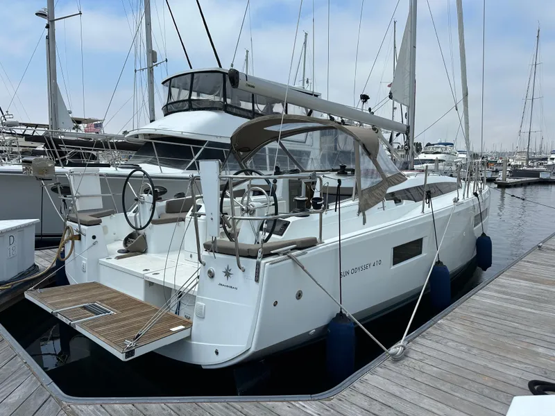Slide: The Image of 2020 Jeanneau Sun Odyssey 410 sailboat docked at marina. - 8