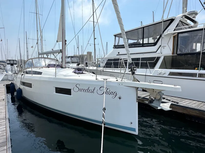 Slide: The Image of 2020 Jeanneau Sun Odyssey 410 sailboat docked in marina, named "Sweetest Thing." - 9