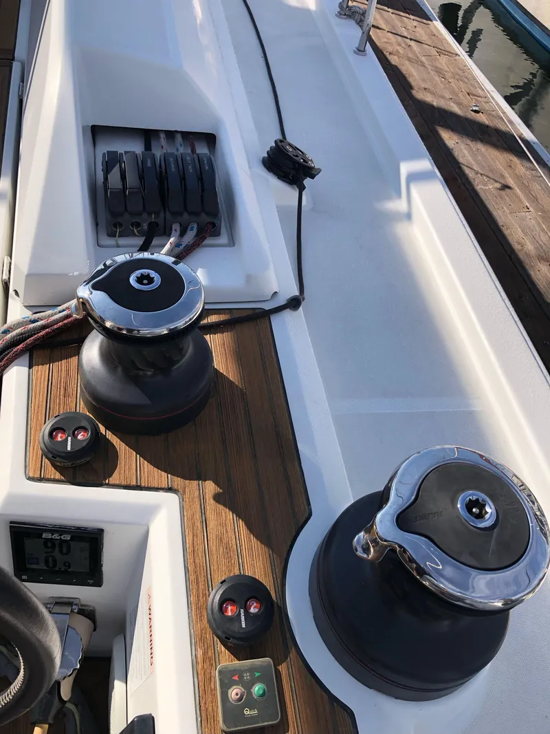 Slide: The Image of 2019 Beneteau Oceanis 51.1 yacht deck with winches and control panel. - 15