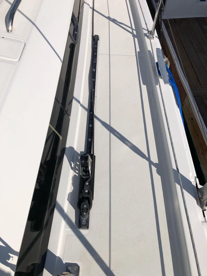 Slide: The Image of 2019 Beneteau Oceanis 51.1 deck with rail system, showcasing sleek design and functionality. - 17