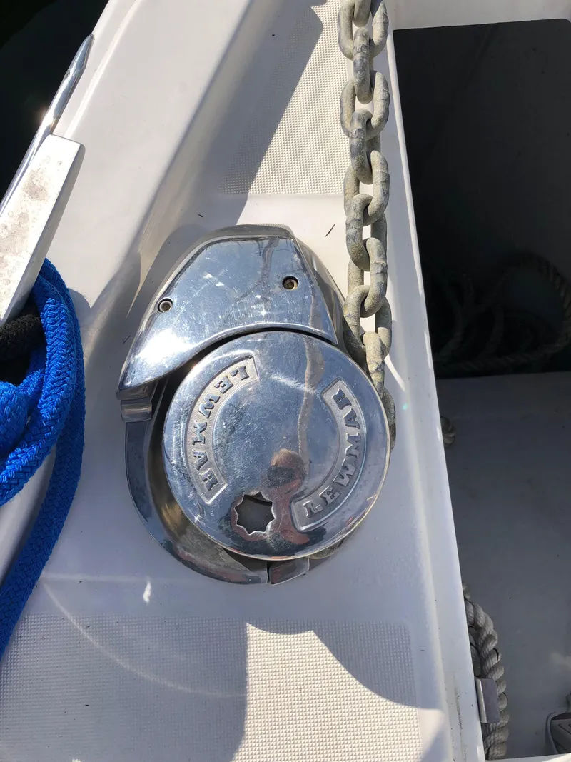 Slide: The Image of Anchor windlass on 2019 Beneteau Oceanis 51.1 yacht deck with chain and rope. - 20