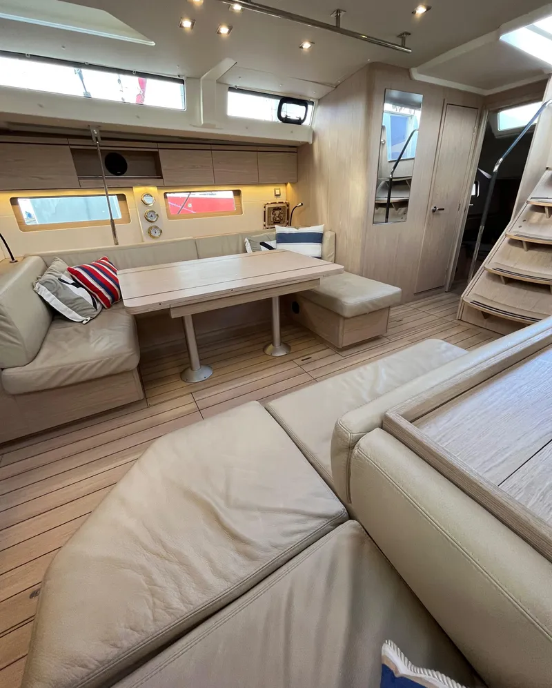 Slide: The Image of Luxurious interior of 2019 Beneteau Oceanis 51.1 yacht with elegant seating and dining area. - 23