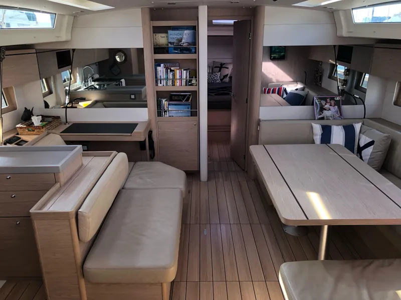 Slide: The Image of Luxurious interior of 2019 Beneteau Oceanis 51.1 yacht with modern furnishings and ample natural light. - 27