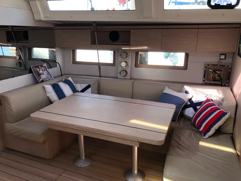 Slide: The Image of Interior of 2019 Beneteau Oceanis 51.1 yacht with cozy seating and nautical decor. - 28