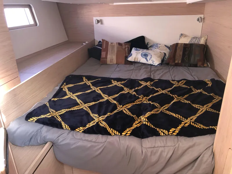 Slide: The Image of Cozy cabin interior of 2019 Beneteau Oceanis 51.1 yacht with comfortable bedding and pillows. - 32