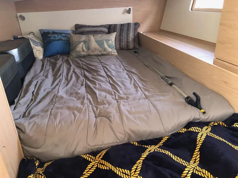 Slide: The Image of Cozy cabin interior of 2019 Beneteau Oceanis 51.1 with plush bedding and nautical-themed pillows. - 33
