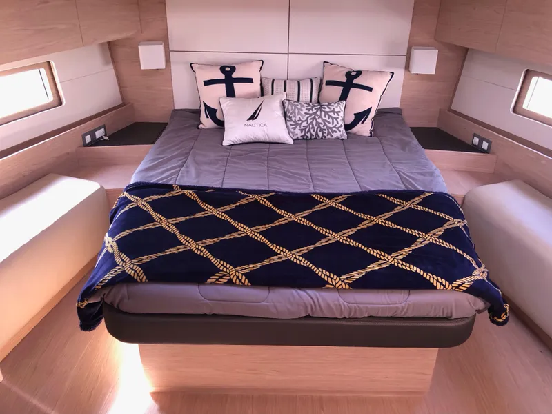 Slide: The Image of Luxurious cabin interior of 2019 Beneteau Oceanis 51.1 yacht with nautical-themed bedding. - 34