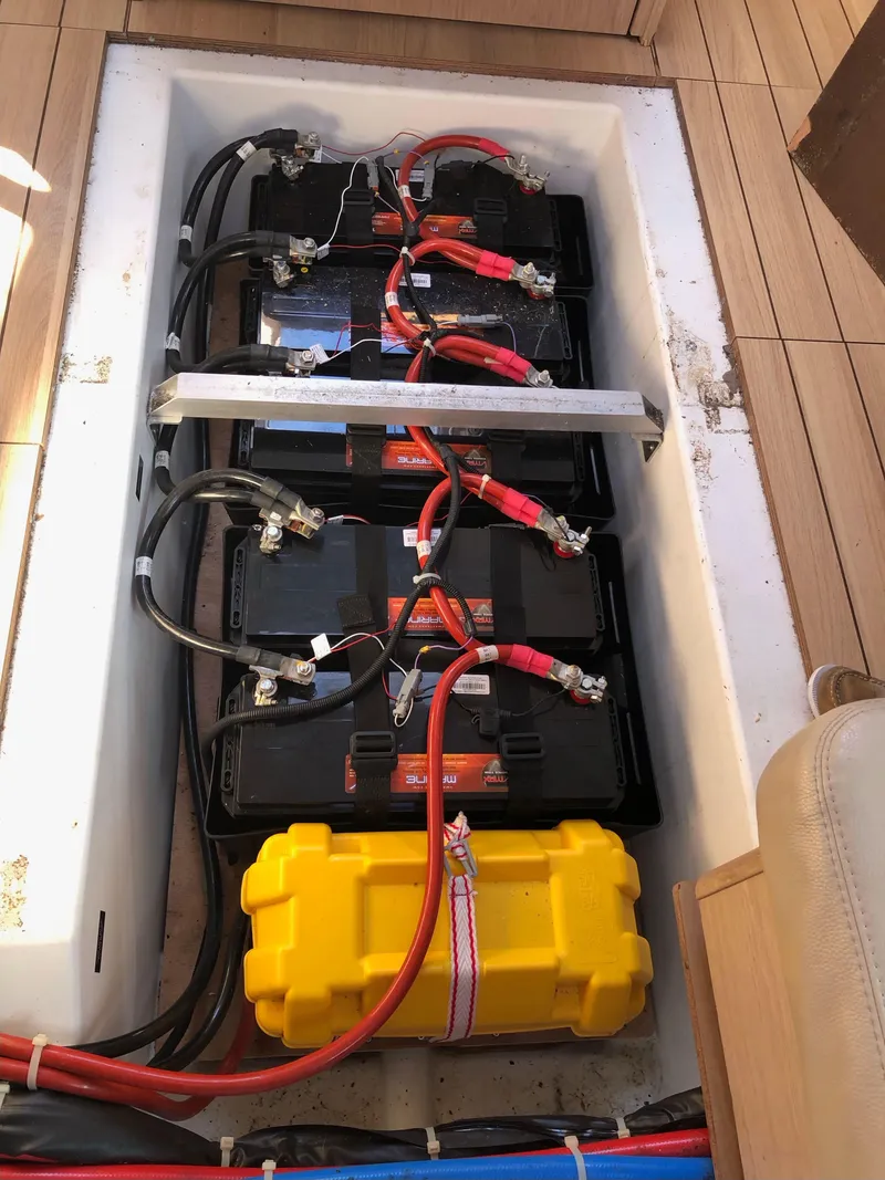 Slide: The Image of Battery compartment of 2019 Beneteau Oceanis 51.1 sailboat with wiring and connections. - 36