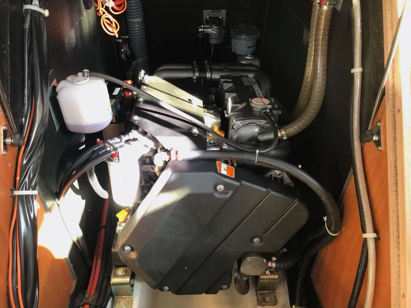 Slide: The Image of Engine compartment of a 2019 Beneteau Oceanis 51.1 sailboat, showcasing mechanical components. - 38