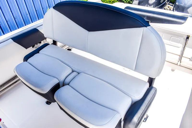 Slide: The Image of 2019 Robalo R242 Center Console boat seat, featuring sleek, cushioned design. - 7