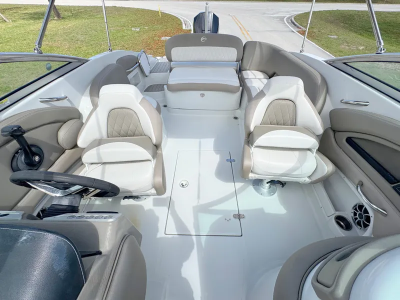 Slide: The Image of 2022 Crownline Eclipse E235 XS boat interior with plush seating and modern design. - 11