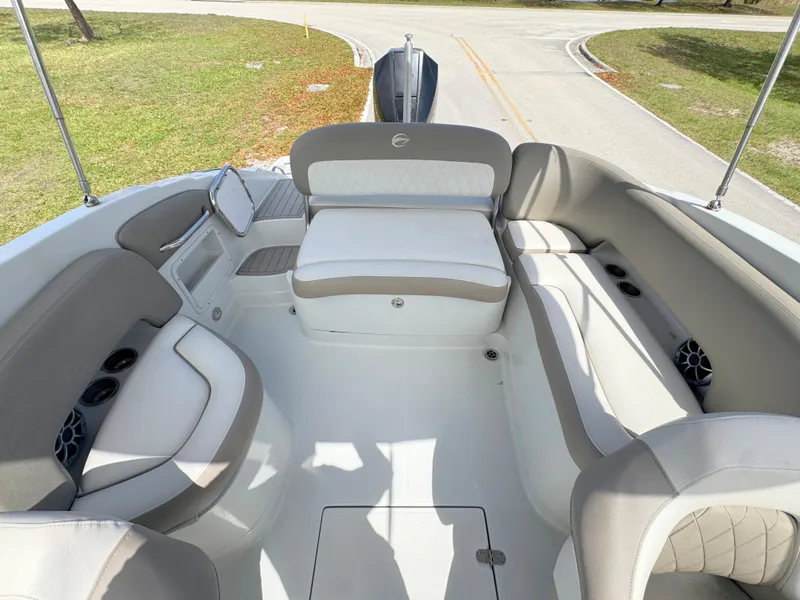Slide: The Image of 2022 Crownline Eclipse E235 XS boat interior with spacious seating and modern design. - 21