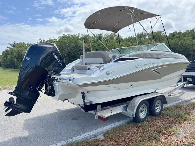 Slide: The Image of 2022 Crownline Eclipse E235 XS boat on trailer with Mercury outboard motor. - 4