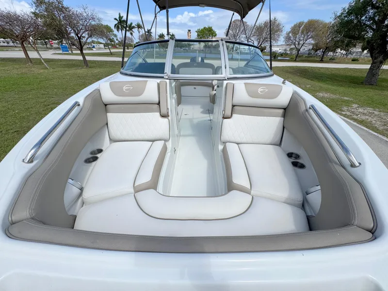 Slide: The Image of 2022 Crownline Eclipse E235 XS boat with spacious seating and sleek design. - 7