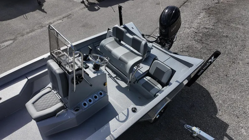 Slide: The Image of 2025 Xpress H20B boat interior with seating and steering console. - 30
