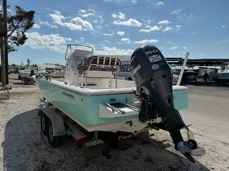 The Image of 2017 Tidewater 2110 Bay Max boat on trailer with Yamaha 150 engine, parked outdoors. - 1