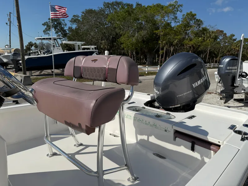 Slide: The Image of 2017 Tidewater 2110 Bay Max boat with Yamaha engine, American flag in background. - 3
