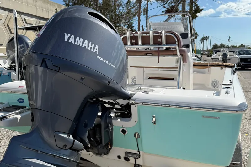 Slide: The Image of 2017 Tidewater 2110 Bay Max boat with Yamaha outboard motor, parked outdoors. - 4