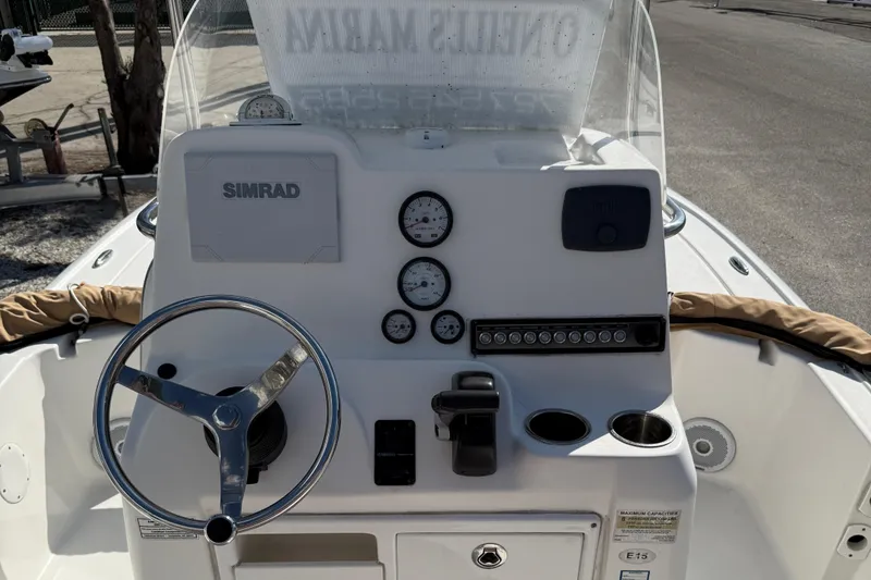 Slide: The Image of 2017 Tidewater 2110 Bay Max boat console with steering wheel and gauges. - 6
